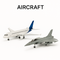 Diecast aircraft models – commercial passenger jet and military fighter jet on white background