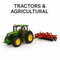 John Deere diecast tractor model with red agricultural cultivator on white background