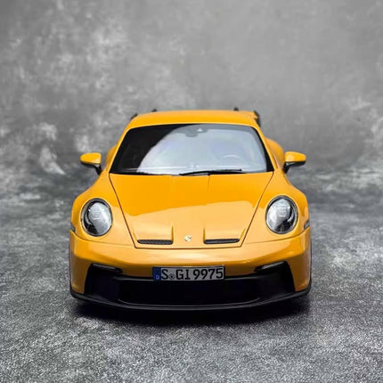 Norev 2021 Porsche 911 GT3 Yellow 1:18 Diecast Model Car - studio product photo of the scale model