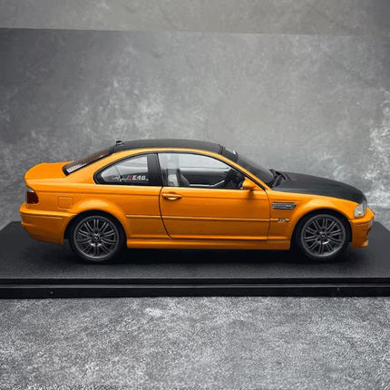 Solido BMW E46 M3 Coupe Works Orange 2000 1:18 Diecast Model Car - studio product photo of the scale model