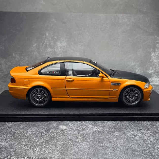 Solido BMW E46 M3 Coupe Works Orange 2000 1:18 Diecast Model Car - studio product photo of the scale model