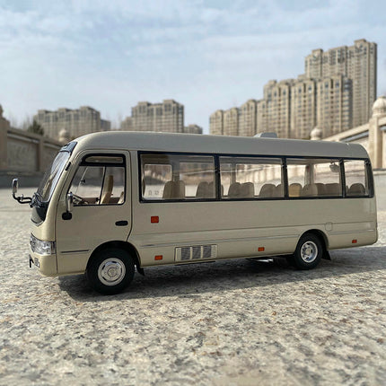 Original Toyota Coaster Bus Light Champagne 1:24 Diecast Model Bus - studio product photo of the scale model