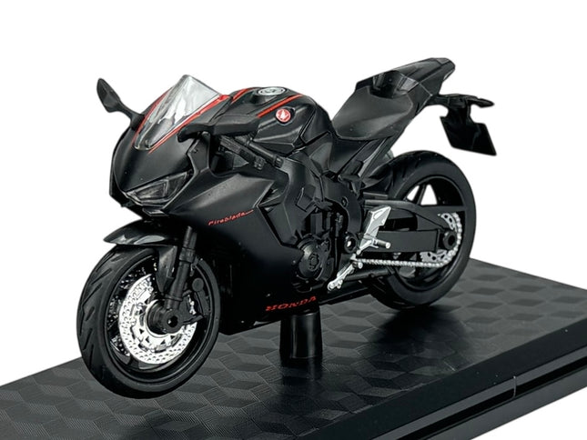 1:18 scale diecast model of a black Honda Fireblade sport motorcycle on display stand