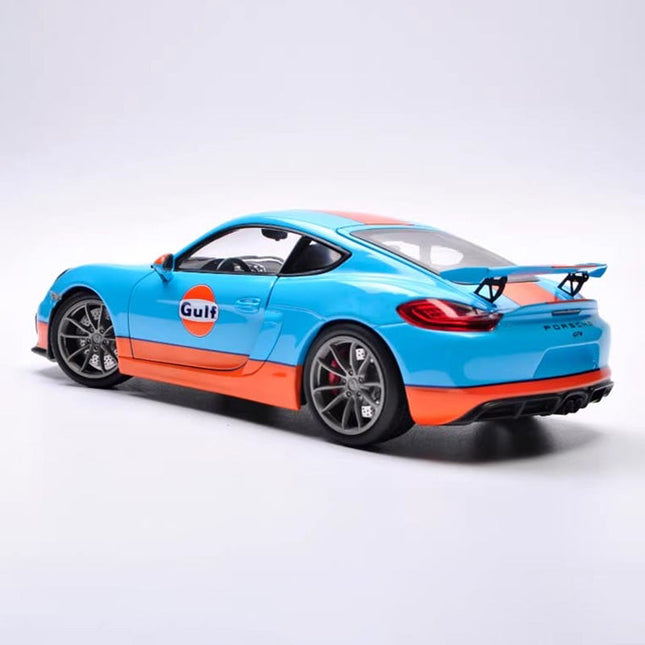 Schuco Porsche Cayman GT4 Gulf Edition 1:18 Diecast Model Car - studio product photo of the scale model
