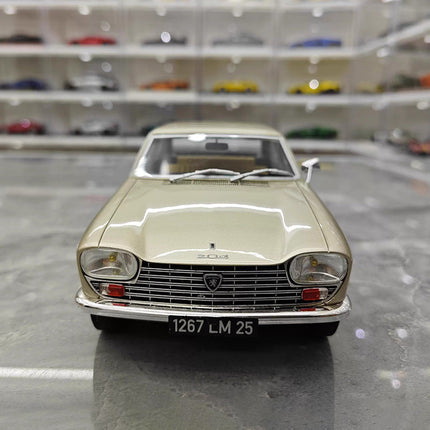 Otto Peugeot 204 (1965) Gold 1:18 Resin Model Car - studio product photo of the scale model