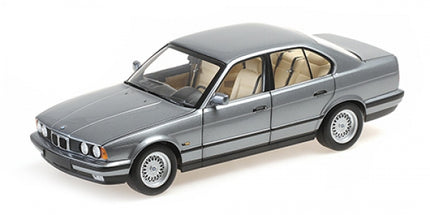 1:18 scale grey BMW diecast model car with detailed interior on white background