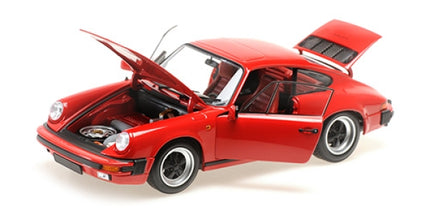 Red Porsche diecast model car 1:18 scale with open doors, hood, and trunk