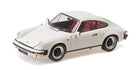 1:18 scale white Porsche diecast model car with red interior, classic coupe design