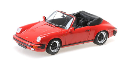 Red Porsche convertible diecast model car with black interior, 1:18 scale, detailed wheels