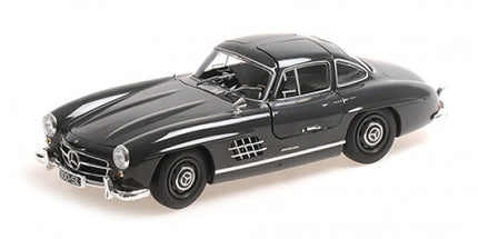 1:18 scale diecast model car, classic black coupe with distinctive chrome details