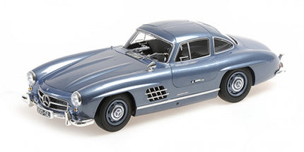 1:18 scale diecast model car in metallic blue, classic coupe with detailed exterior