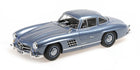 1:18 scale diecast model car in metallic blue, classic coupe with detailed exterior
