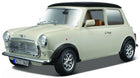 1:18 scale classic Mini Cooper diecast model car, cream with black roof and chrome details