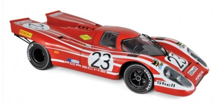 Red and white Porsche 917 diecast model car with racing decals and the number 23
