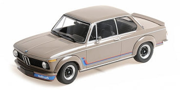 1:18 scale diecast BMW model car in beige with detailed racing stripes and black interior