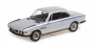 1:18 scale silver BMW diecast model car with racing stripes, detailed wheels and trim