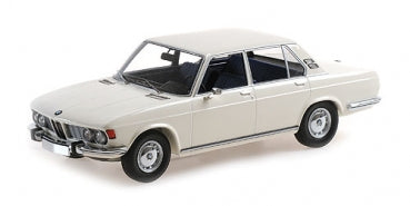 1:18 scale classic white BMW diecast model car with chrome details, side view
