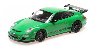Green 1:18 scale Porsche diecast model car with black wheels and rear spoiler