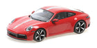 Red Porsche 911 diecast model car 1:18 scale with white racing stripes on white background