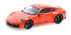 1:18 scale red Porsche diecast model car with black wheels and detailed exterior