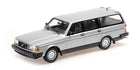 Diecast silver Volvo 240 station wagon model car, 1:18 scale, on white background