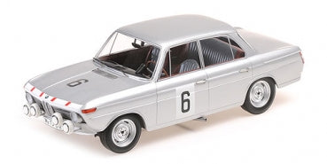Silver diecast classic rally car model with racing stripe and number 6, 1:18 scale.