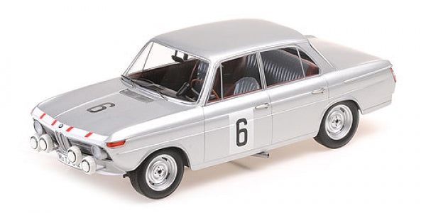 Silver diecast model car 1:18 scale with racing number 6 and rally headlights
