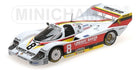 1:18 scale diecast Porsche race car model with red, yellow, and black livery, number 8