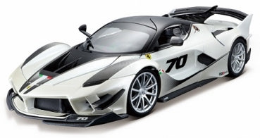 White diecast model sports car with black accents, number 70, aerodynamic features, 1:18 scale