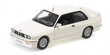 White 1:18 scale diecast BMW model car with detailed wheels and rear spoiler