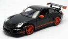 1:18 scale diecast black Porsche model car with orange wheels and rear spoiler