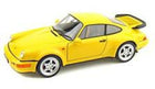 Yellow diecast model sports car with rear spoiler on white background