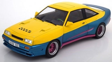 1:18 scale diecast model car in yellow and blue with pink accents, detailed sports coupe design