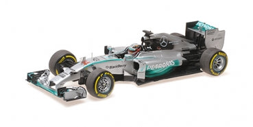 1:18 scale silver diecast Formula 1 race car model with detailed sponsor logos and yellow tires