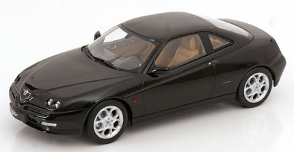 1:18 scale black diecast model car with detailed interior, silver rims, and coupe design