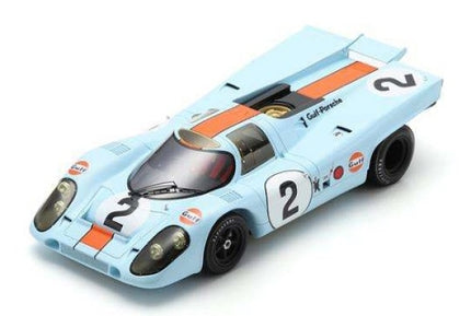 1:18 scale diecast Porsche 917 racing car, light blue with orange stripes and number 2 decals