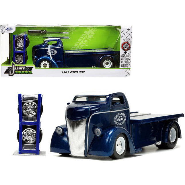 https://cdn.shopify.com/s/files/1/0504/9925/6496/files/1947-ford-coe-flatbed-truck-dark-blue-metallic-with-white-top-the-famous-motor-cars-with-extra-wheels-just-trucks-series-124-diecast-model-by-jada-330969.jpg?v=1748419220