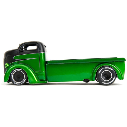 https://cdn.shopify.com/s/files/1/0504/9925/6496/files/1947-ford-coe-flatbed-truck-green-metallic-and-matt-black-toyo-tires-with-extra-wheels-just-trucks-series-124-diecast-model-car-by-jada-379604.jpg?v=1748405264