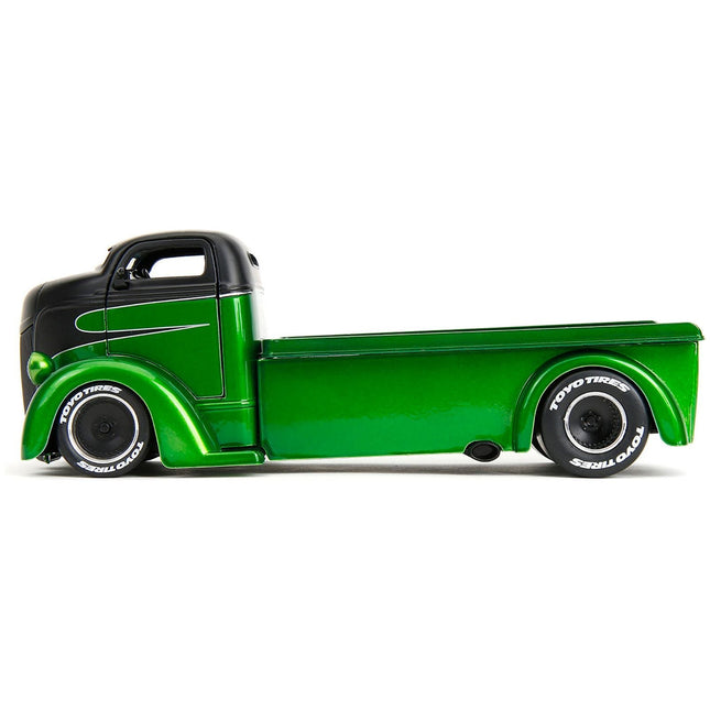 https://cdn.shopify.com/s/files/1/0504/9925/6496/files/1947-ford-coe-flatbed-truck-green-metallic-and-matt-black-toyo-tires-with-extra-wheels-just-trucks-series-124-diecast-model-car-by-jada-379604.jpg?v=1748405264