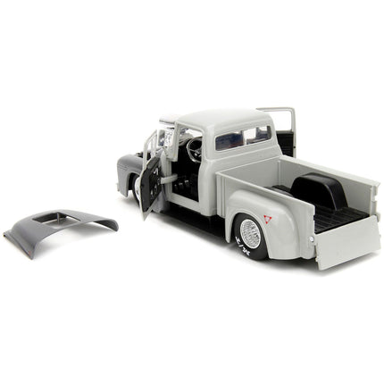 https://cdn.shopify.com/s/files/1/0504/9925/6496/files/1956-ford-f-100-pickup-truck-tan-and-gray-metallic-and-guile-diecast-figure-street-fighter-video-game-anime-hollywood-rides-series-124-diecast-model-car-by-jada-403637.jpg?v=1748419128