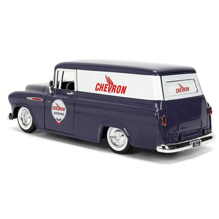 https://cdn.shopify.com/s/files/1/0504/9925/6496/files/1957-chevrolet-suburban-chevron-dark-blue-with-white-stripes-and-chevron-gas-pump-just-trucks-series-124-diecast-model-car-by-jada-269079.jpg?v=1756087061