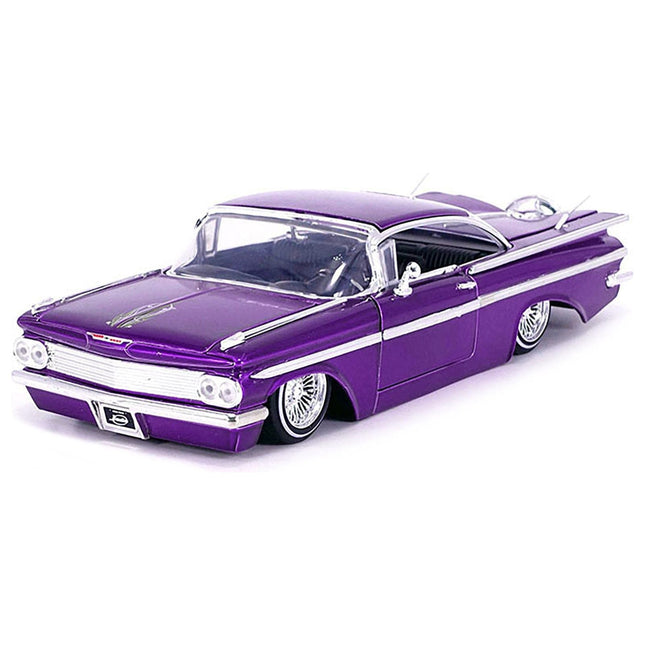 https://cdn.shopify.com/s/files/1/0504/9925/6496/files/1959-chevrolet-impala-lowrider-candy-purple-with-wire-wheels-street-low-series-124-diecast-model-car-by-jada-474383.jpg?v=1748405264