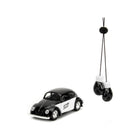https://cdn.shopify.com/s/files/1/0504/9925/6496/files/1959-volkswagen-beetle-punch-buggy-black-and-white-and-boxing-gloves-accessory-punch-buggy-series-132-diecast-model-car-by-jada-284103.jpg?v=1748419122