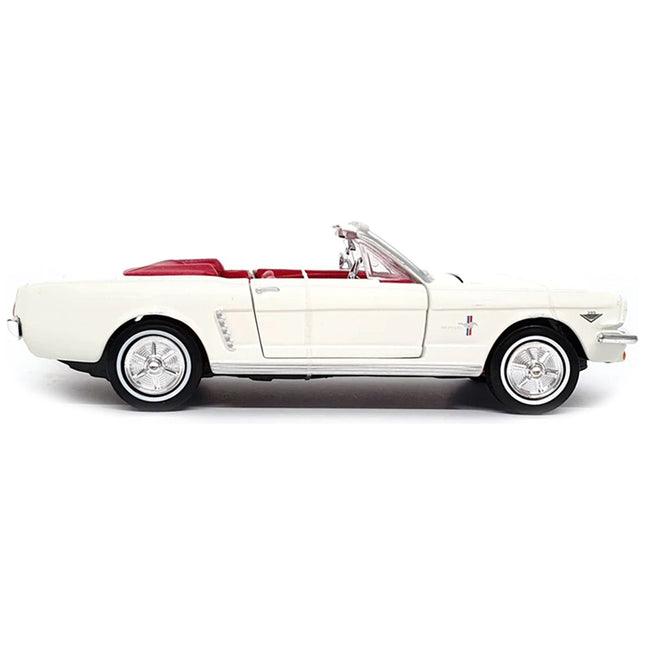https://cdn.shopify.com/s/files/1/0504/9925/6496/files/1964-12-ford-mustang-convertible-white-with-red-interior-james-bond-007-goldfinger-1964-movie-james-bond-collection-series-124-diecast-model-car-by-motormax-988332.jpg?v=1748418082