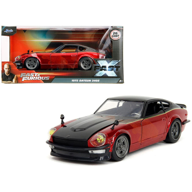 https://cdn.shopify.com/s/files/1/0504/9925/6496/files/1972-datsun-240z-black-and-red-metallic-with-graphics-fast-x-2023-movie-fast-furious-series-124-diecast-model-car-by-jada-959783.jpg?v=1748419006