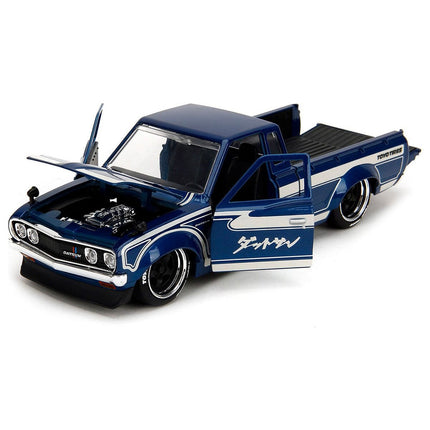 https://cdn.shopify.com/s/files/1/0504/9925/6496/files/1972-datsun-620-pickup-truck-blue-metallic-and-cream-jdm-tuners-series-124-diecast-model-car-by-jada-315337.jpg?v=1748403642