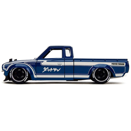 https://cdn.shopify.com/s/files/1/0504/9925/6496/files/1972-datsun-620-pickup-truck-blue-metallic-and-cream-jdm-tuners-series-124-diecast-model-car-by-jada-925924.jpg?v=1748403642