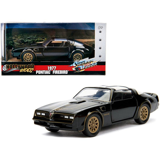 https://cdn.shopify.com/s/files/1/0504/9925/6496/files/1977-pontiac-firebird-black-smokey-and-the-bandit-1977-movie-hollywood-rides-series-132-diecast-model-car-by-jada-827644.jpg?v=1748419488
