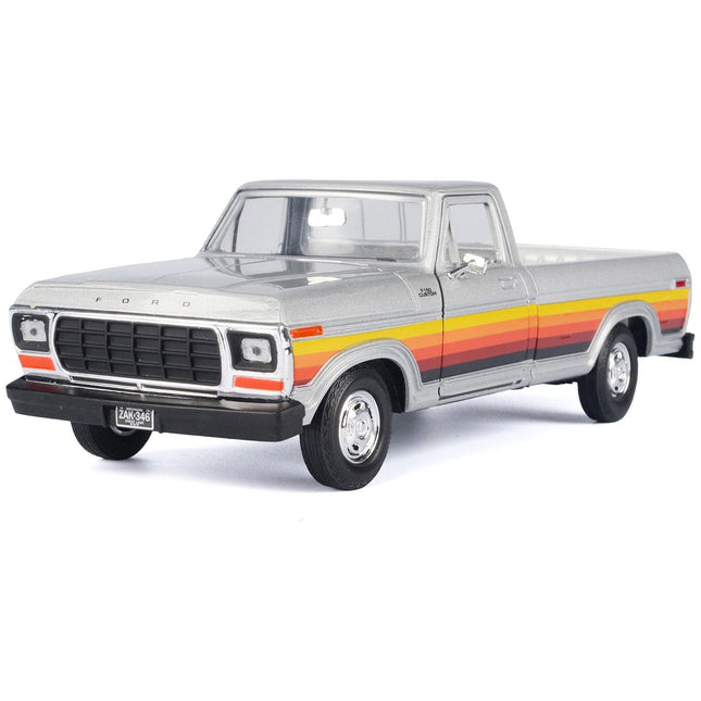 https://cdn.shopify.com/s/files/1/0504/9925/6496/files/1979-ford-f-150-custom-pickup-truck-silver-metallic-with-side-stripes-american-classics-series-124-diecast-model-car-by-motormax-334050.jpg?v=1748405279