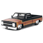 https://cdn.shopify.com/s/files/1/0504/9925/6496/files/1985-chevrolet-c-10-pickup-truck-black-with-stripes-and-gm-rally-wheels-just-trucks-series-124-diecast-model-car-by-jada-503352.jpg?v=1748404990